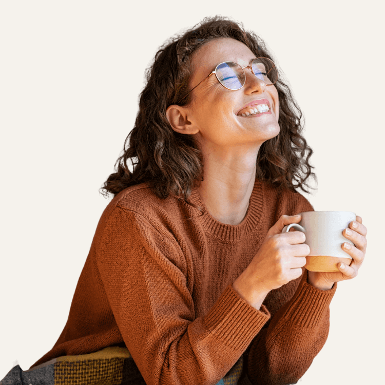 Person enjoying Fuelly protein coffee at home, saving time and money compared to cafe coffee